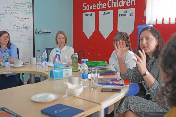 Lisa makes a point during engagement with Save the Children Officials