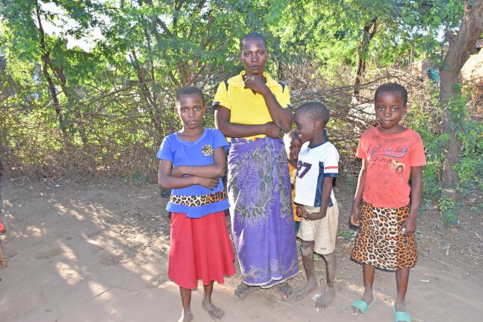 Esnat (Left) captures with her mom and siblings - she is now at a camp for the third time in two years.