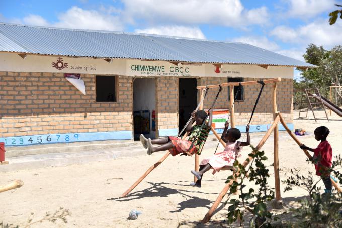 Children enjoying their time on the swings at Chimwemwe Community Based Child Care Center (CBCC)